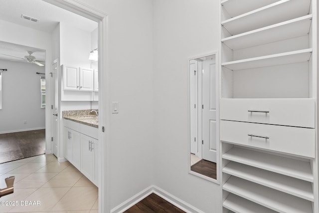 562 Landshark Blvd, Daytona Beach, FL 32124 - spacious closet with ceiling fan and light tile patterned floors