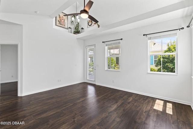562 Landshark Blvd, Daytona Beach, FL 32124 - empty room featuring healthy amount of natural light, ceiling fan, dark wood-style floors, and a smoke detector