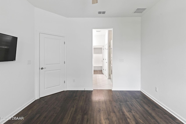 562 Landshark Blvd, Daytona Beach, FL 32124 - unfurnished bedroom featuring wood finished floors and ensuite bathroom