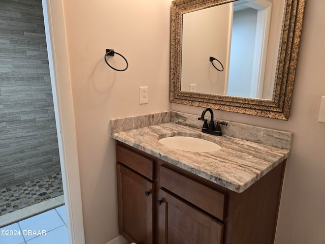 bathroom featuring tile patterned flooring and vanity