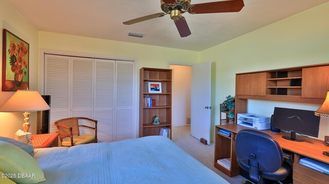 bedroom with carpet, visible vents, a closet, and ceiling fan