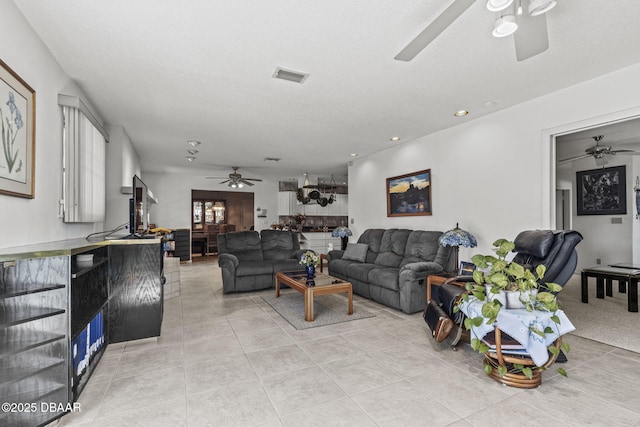 living area with recessed lighting, light tile patterned floors, a ceiling fan, and visible vents