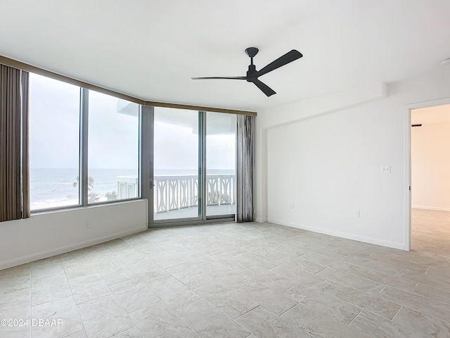1133 Ocean Shore Blvd Unit 202, Ormond Beach, FL 32176 - empty room featuring ceiling fan and baseboards