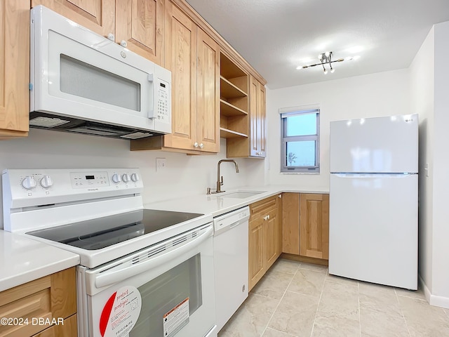 1133 Ocean Shore Blvd Unit 202, Ormond Beach, FL 32176 - kitchen featuring white appliances, light brown cabinetry, light countertops, and open shelves