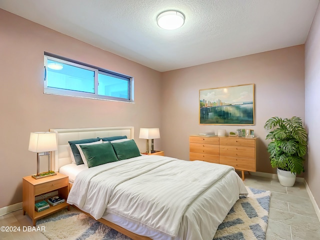 bedroom with a textured ceiling