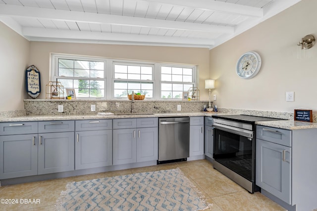 kitchen with wooden ceiling, vaulted ceiling with beams, light stone countertops, light tile patterned floors, and stainless steel appliances