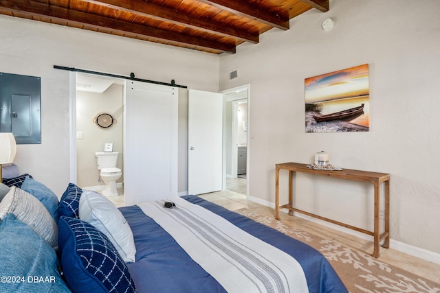 bedroom with ensuite bathroom, a barn door, wooden ceiling, beamed ceiling, and electric panel