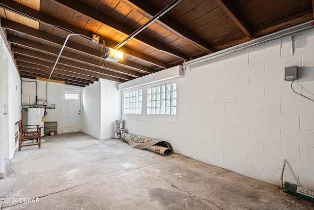 basement with wood ceiling and gas water heater