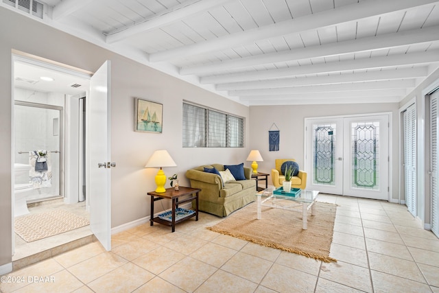 tiled living room featuring beamed ceiling, wood ceiling, and french doors