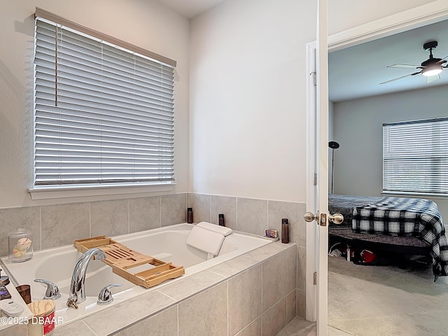 full bathroom featuring a garden tub and a ceiling fan