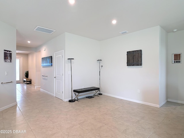 unfurnished room with recessed lighting, visible vents, and baseboards