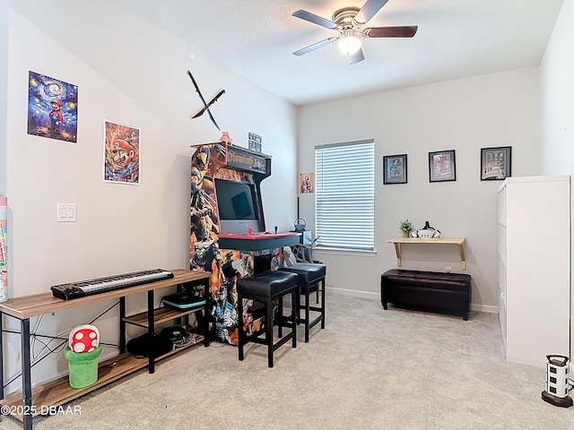 rec room with carpet flooring, baseboards, and a ceiling fan