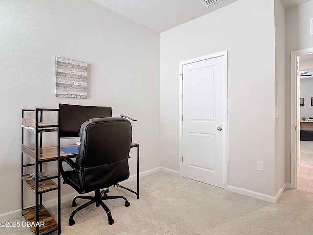 home office with carpet flooring, visible vents, and baseboards