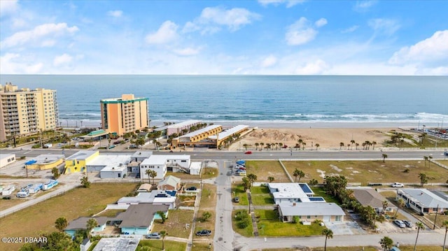 birds eye view of property featuring a view of the beach and a water view