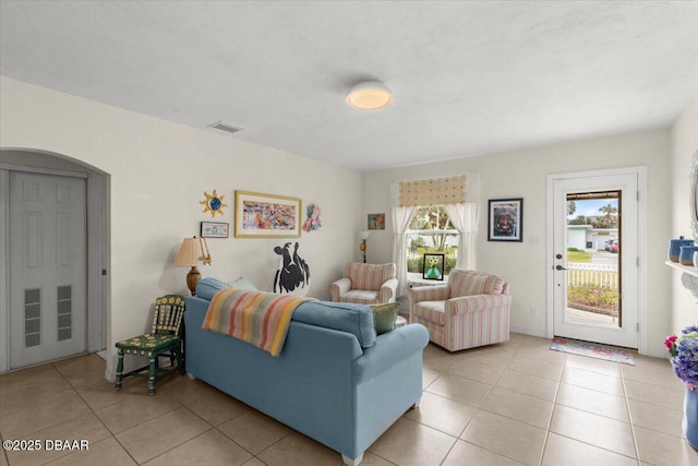 living room with light tile patterned floors