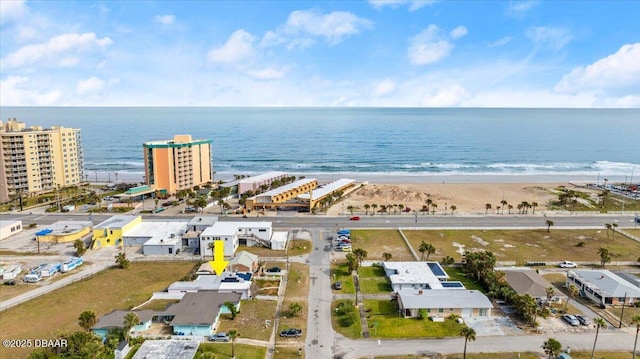 birds eye view of property featuring a view of the beach and a water view