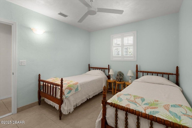 tiled bedroom with ceiling fan