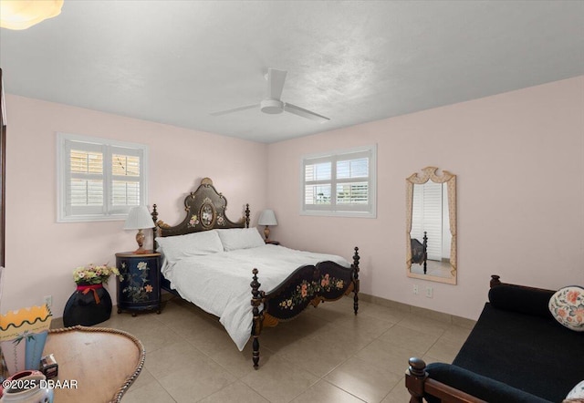 tiled bedroom with ceiling fan