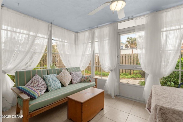 sunroom / solarium featuring ceiling fan