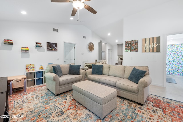 living room with high vaulted ceiling and ceiling fan