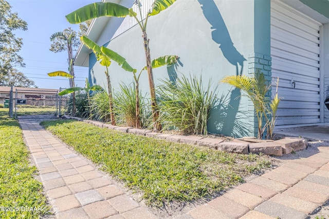 view of property exterior featuring fence