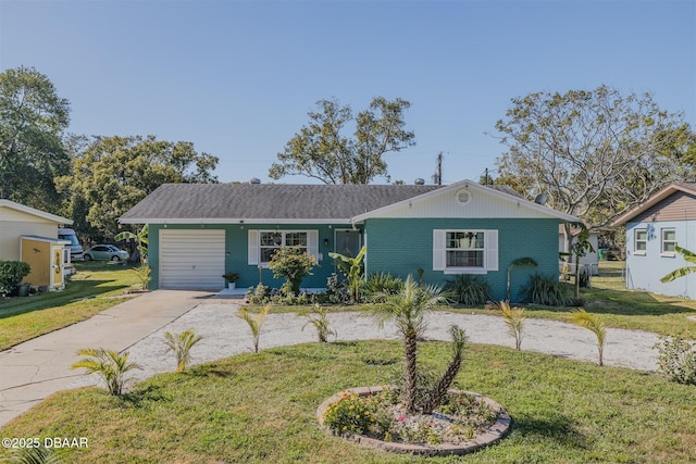 ranch-style home with a garage and a front yard