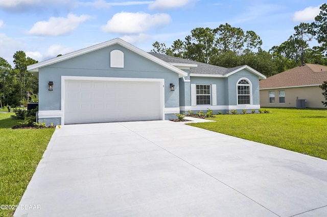 ranch-style house featuring a front lawn and a garage