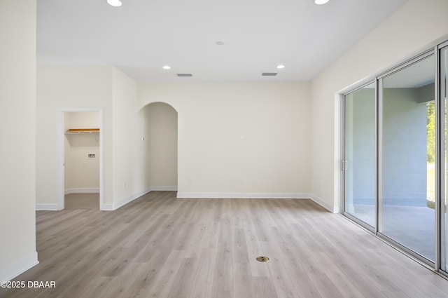 unfurnished room featuring light hardwood / wood-style floors