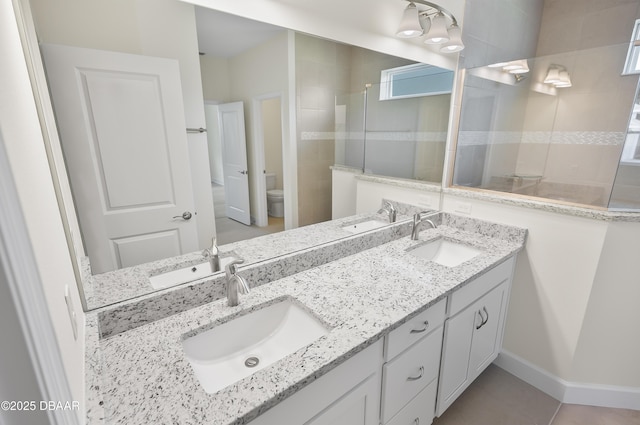 bathroom featuring a shower, toilet, and vanity