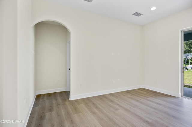 unfurnished room with light hardwood / wood-style floors and plenty of natural light