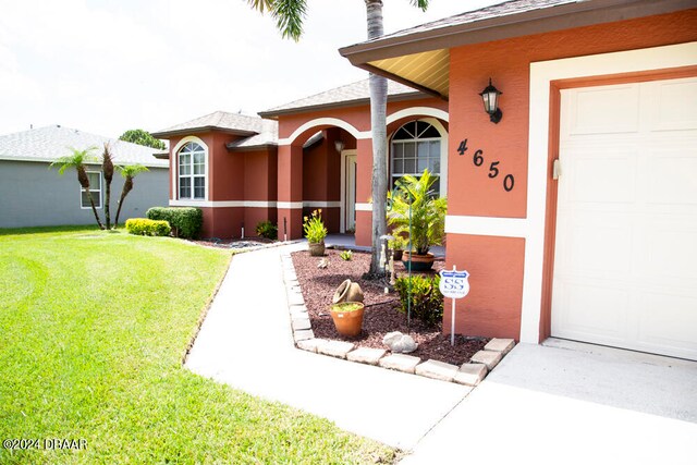 entrance to property with a yard