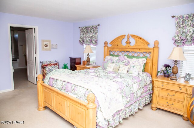 bedroom with light colored carpet