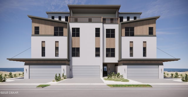 3403 S Atlantic Ave Unit 2, New Smyrna Beach, FL 32169 - view of front facade with driveway, stucco siding, and an attached garage