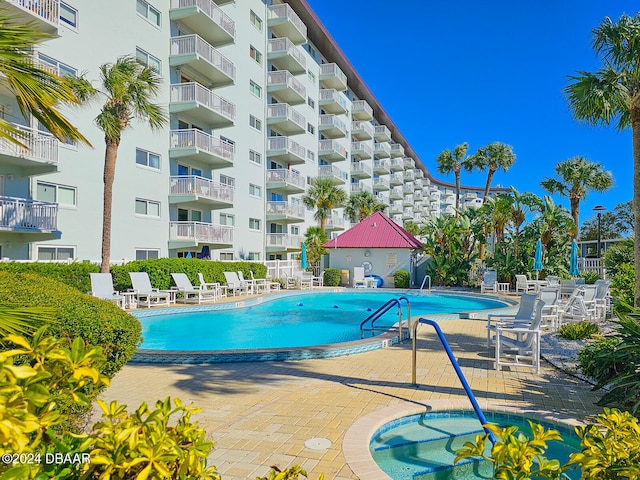 view of swimming pool with a patio