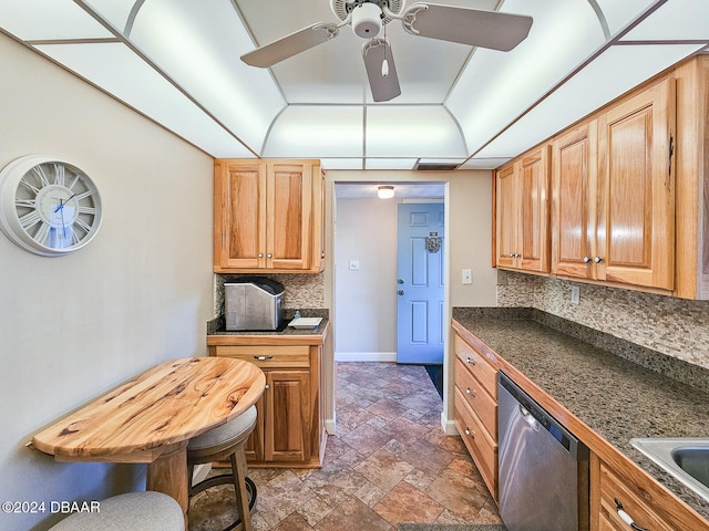 kitchen with dishwasher, decorative backsplash, ceiling fan, and sink