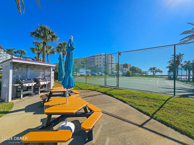 exterior space with tennis court