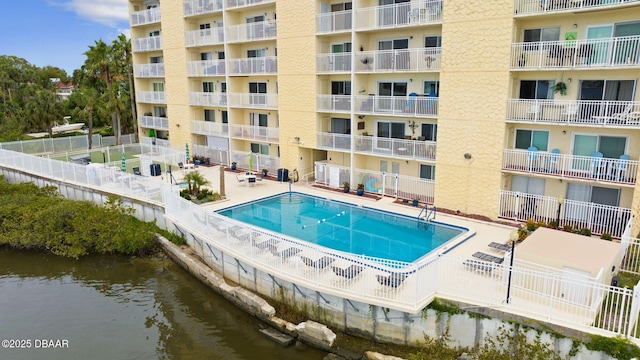 view of swimming pool with a water view