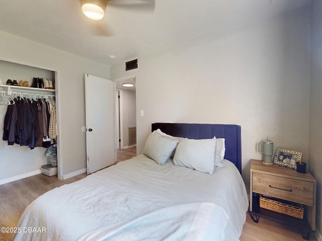 903 Conrad Dr, New Smyrna Beach, FL 32168 - bedroom with wood finished floors, a closet, and ceiling fan