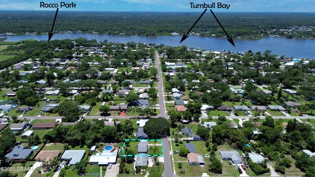 903 Conrad Dr, New Smyrna Beach, FL 32168 - aerial overview of property's location featuring a nearby body of water and property boundaries highlighted