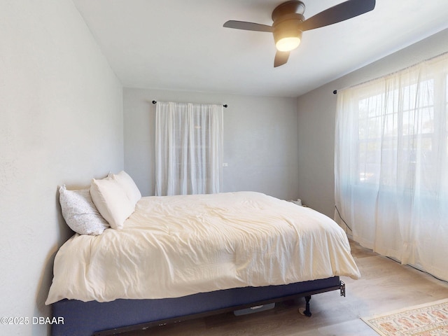 903 Conrad Dr, New Smyrna Beach, FL 32168 - bedroom featuring ceiling fan and wood finished floors