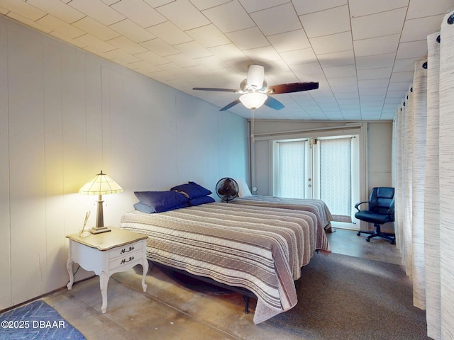 903 Conrad Dr, New Smyrna Beach, FL 32168 - bedroom with concrete floors and ceiling fan