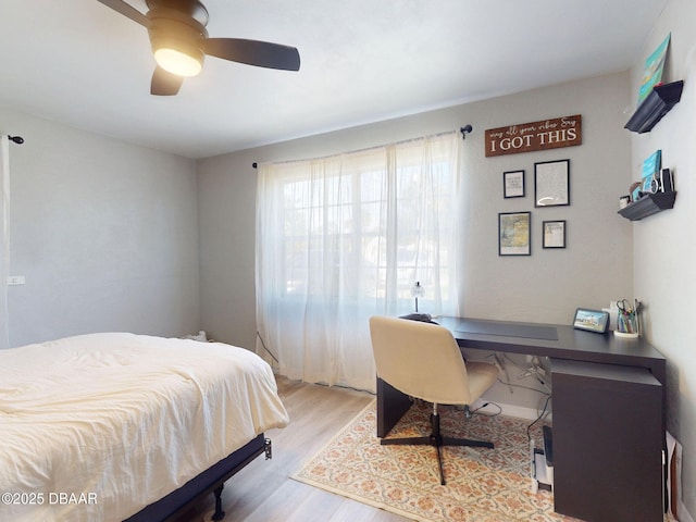 903 Conrad Dr, New Smyrna Beach, FL 32168 - bedroom featuring wood finished floors, a desk, and a ceiling fan