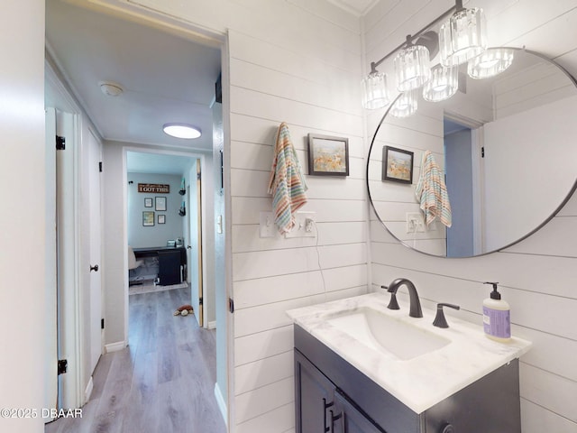 903 Conrad Dr, New Smyrna Beach, FL 32168 - bathroom with vanity and wood finished floors