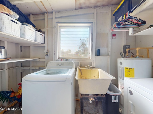 903 Conrad Dr, New Smyrna Beach, FL 32168 - laundry area with washer and dryer and electric water heater