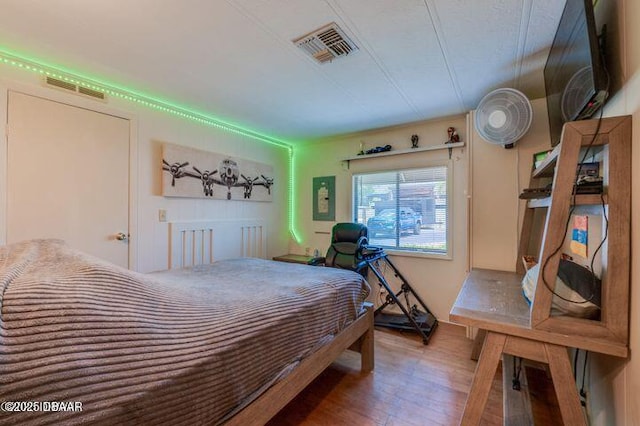 1018 Green Acres Cir Unit N, South Daytona, FL 32119 - bedroom featuring wood finished floors
