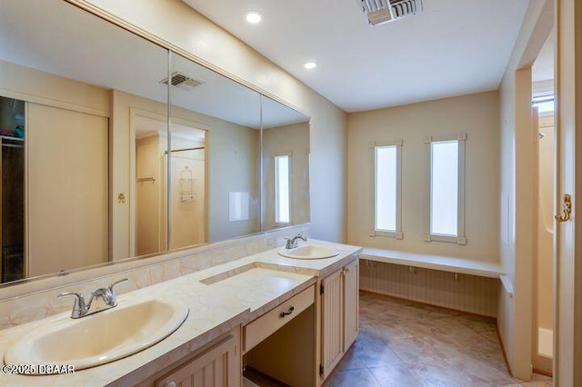 1018 Green Acres Cir Unit N, South Daytona, FL 32119 - bathroom featuring double vanity and recessed lighting