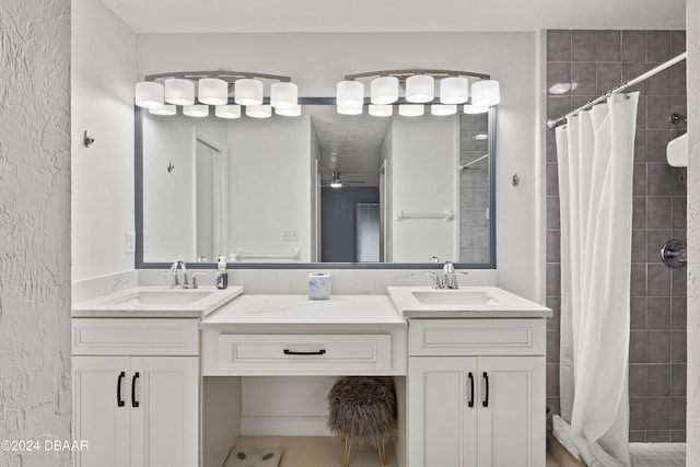 bathroom with a shower with shower curtain, vanity, ceiling fan, and tile patterned flooring