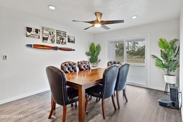 dining area featuring hardwood / wood-style flooring and ceiling fan