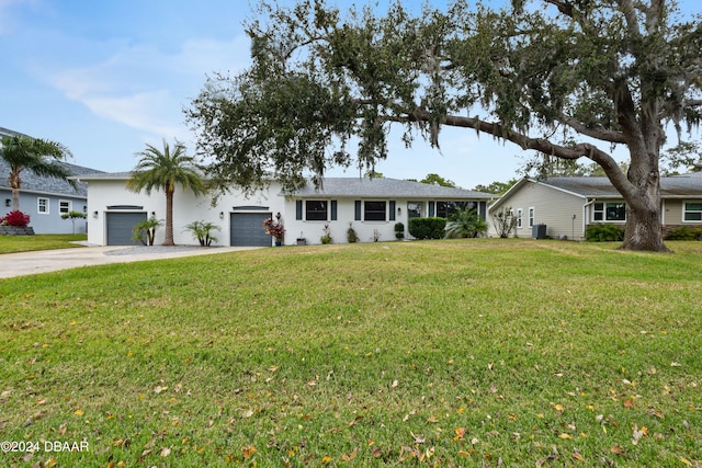 ranch-style home with a front lawn and a garage