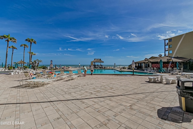2301 S Atlantic Ave Unit 120, Daytona Beach Shores, FL 32118 - community pool featuring a patio